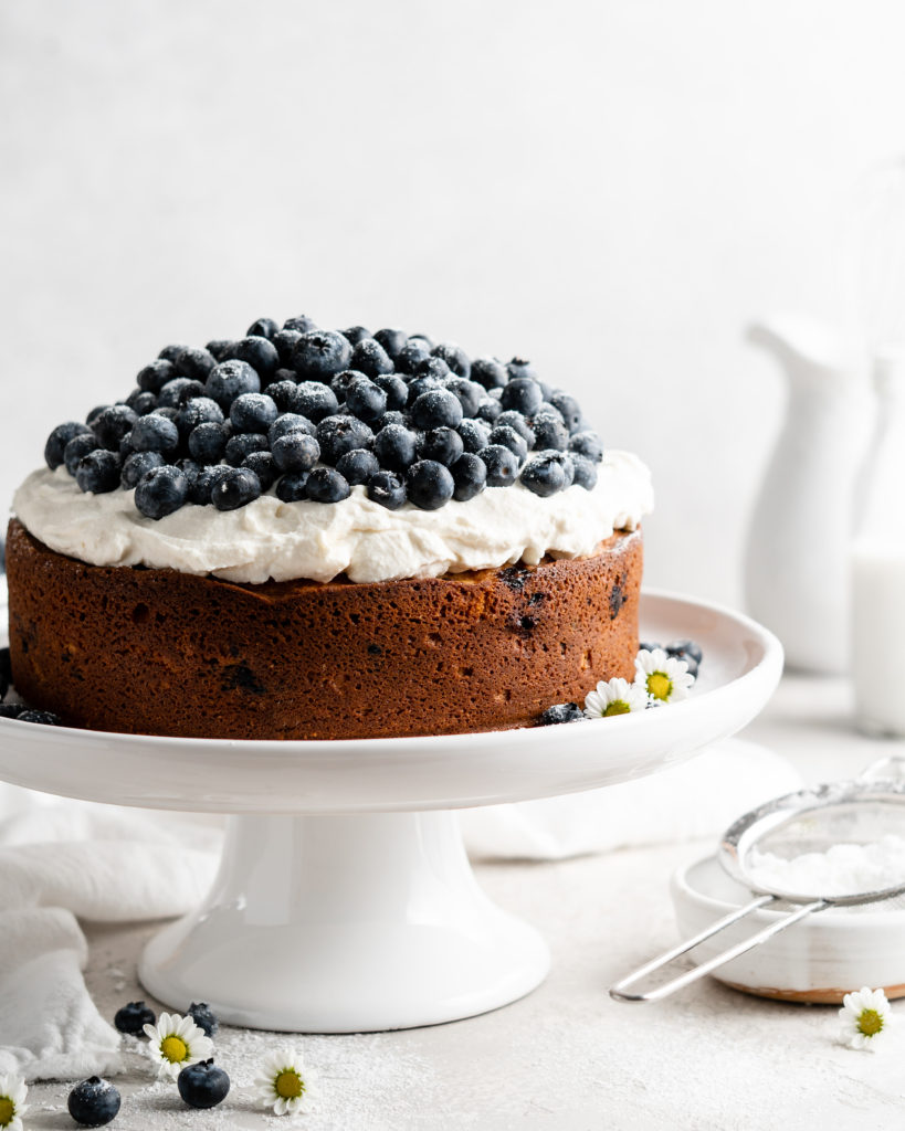 Single layer blueberry elderflower cake is topped with creamy mascarpone whipped cream and a ton of fresh, plump blueberries