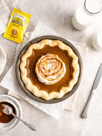 Pumpkin pie with whipped cream and salted caramel