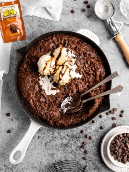 triple chocolate brownie skillet topped with vanilla ice cream