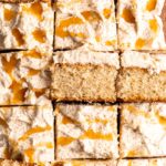 Bourbon Eggnog Sheet Cake with fluffy eggnog frosting, drizzled with caramel sauce