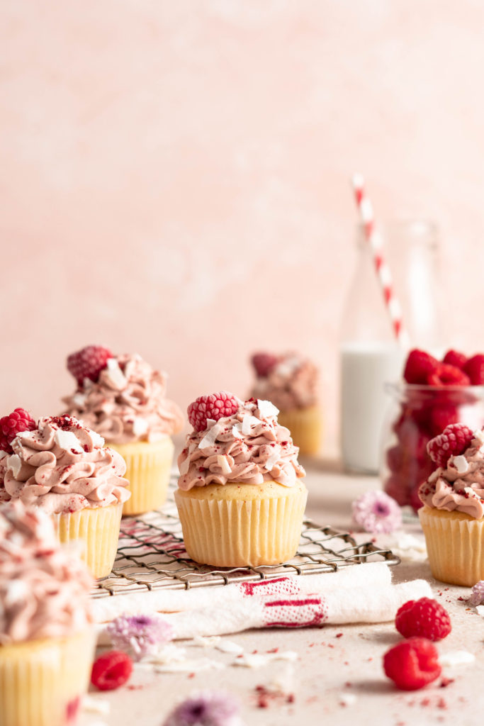 Raspberry Coconut Cupcakes with raspberry whipped cream topping