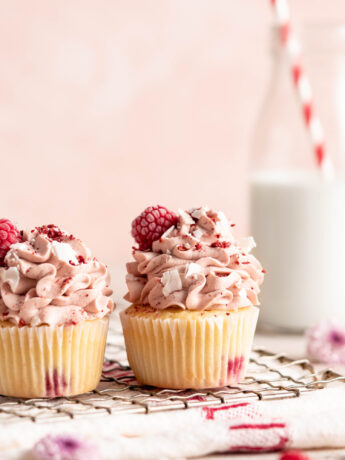 Raspberry Coconut Cupcakes with raspberry whipped cream topping