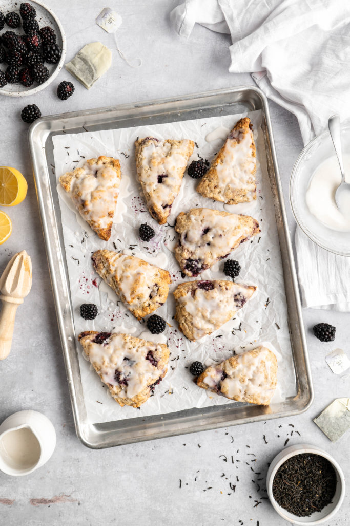blackberry earl grey scones covered in vanilla glaze