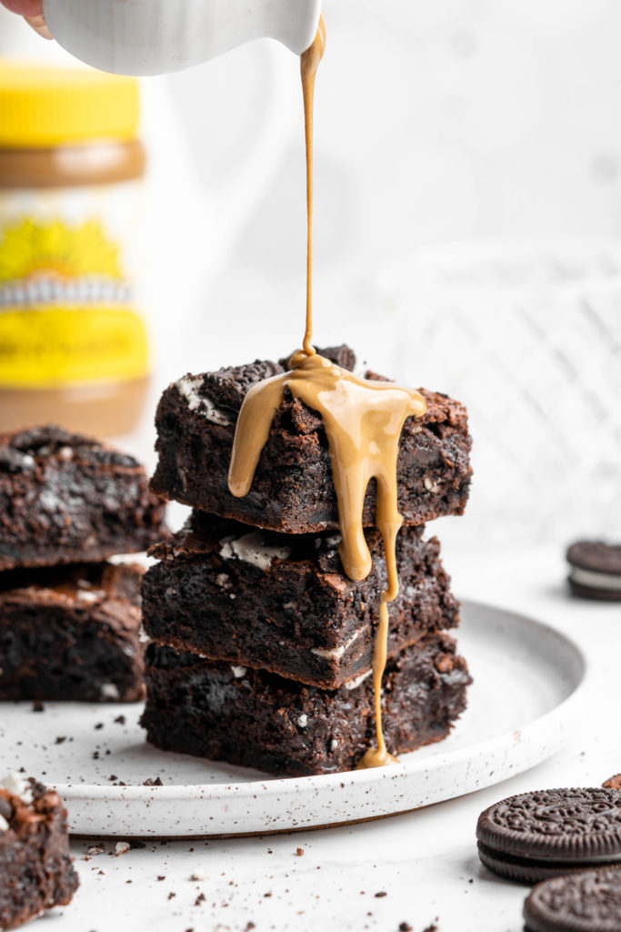 Crinkly top brownies with Oreos on top, drizzled with SunButter