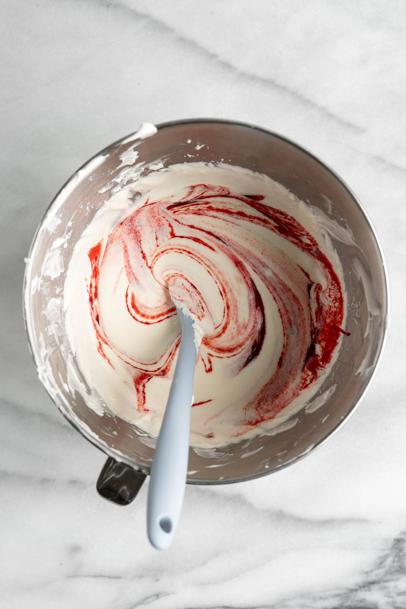 Strawberry jam added to no bake cheesecake filling.