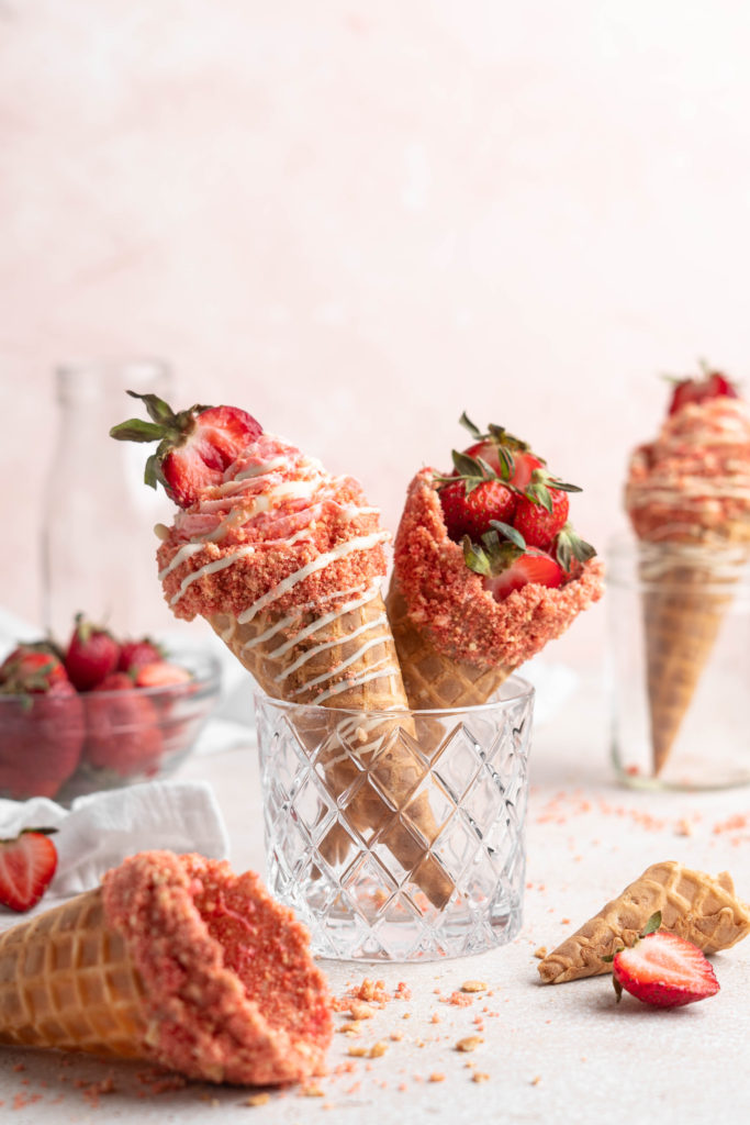 strawberry crunch cheesecake cone in a glass.