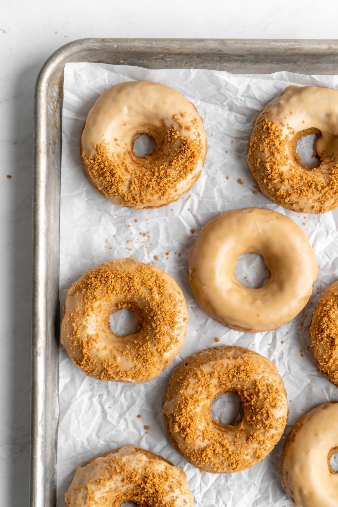 Coffee donuts with coffee glaze sprinkled with crushed biscoff cookies