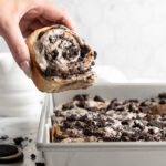 Oreo Cookies and cream cinnamon roll being pulled from pan