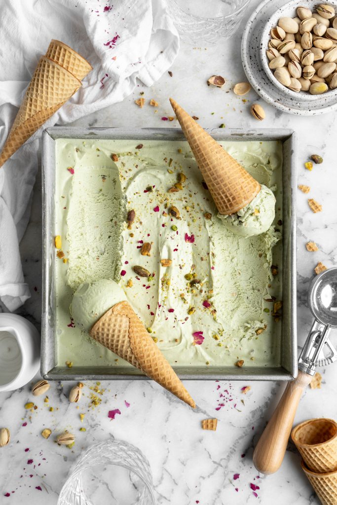 pistachio ice cream in a baking pan with cones